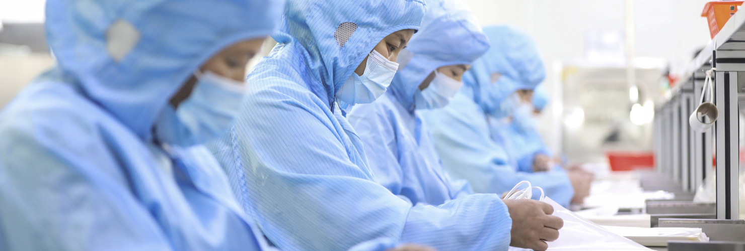 Workers make medical infusion sets for export at a workshop in Huai 'an City, Jiangsu Province, China