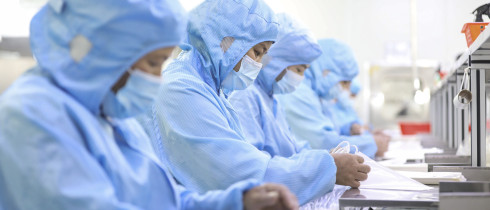 Workers make medical infusion sets for export at a workshop in Huai 'an City, Jiangsu Province, China